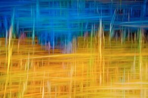 Dynamic abstract artwork featuring vibrant blues and golds, creating a sense of movement.