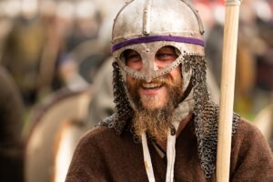 Close-up of a Viking reenactor with chainmail and helmet in Szczecin, Poland.