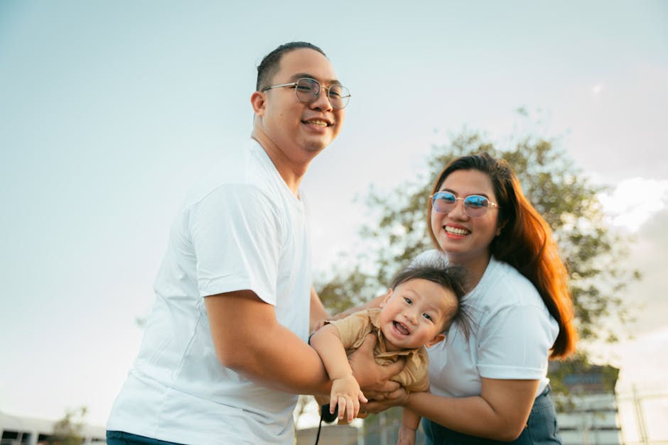 Happy family enjoying an outdoor moment together. Smiling parents and child.