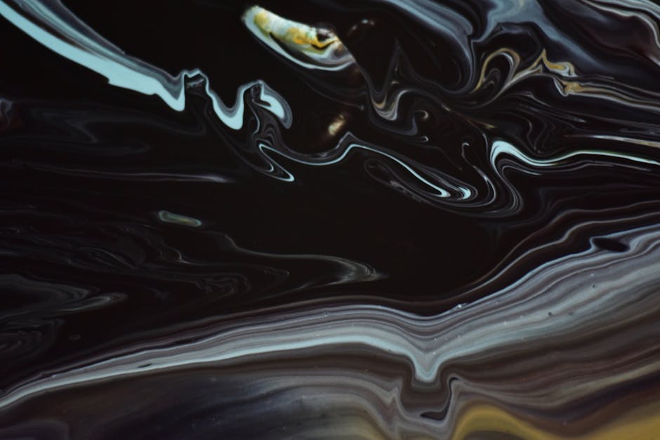 Explore the fluid dynamics of dark-toned abstract art with swirling patterns and depth.
